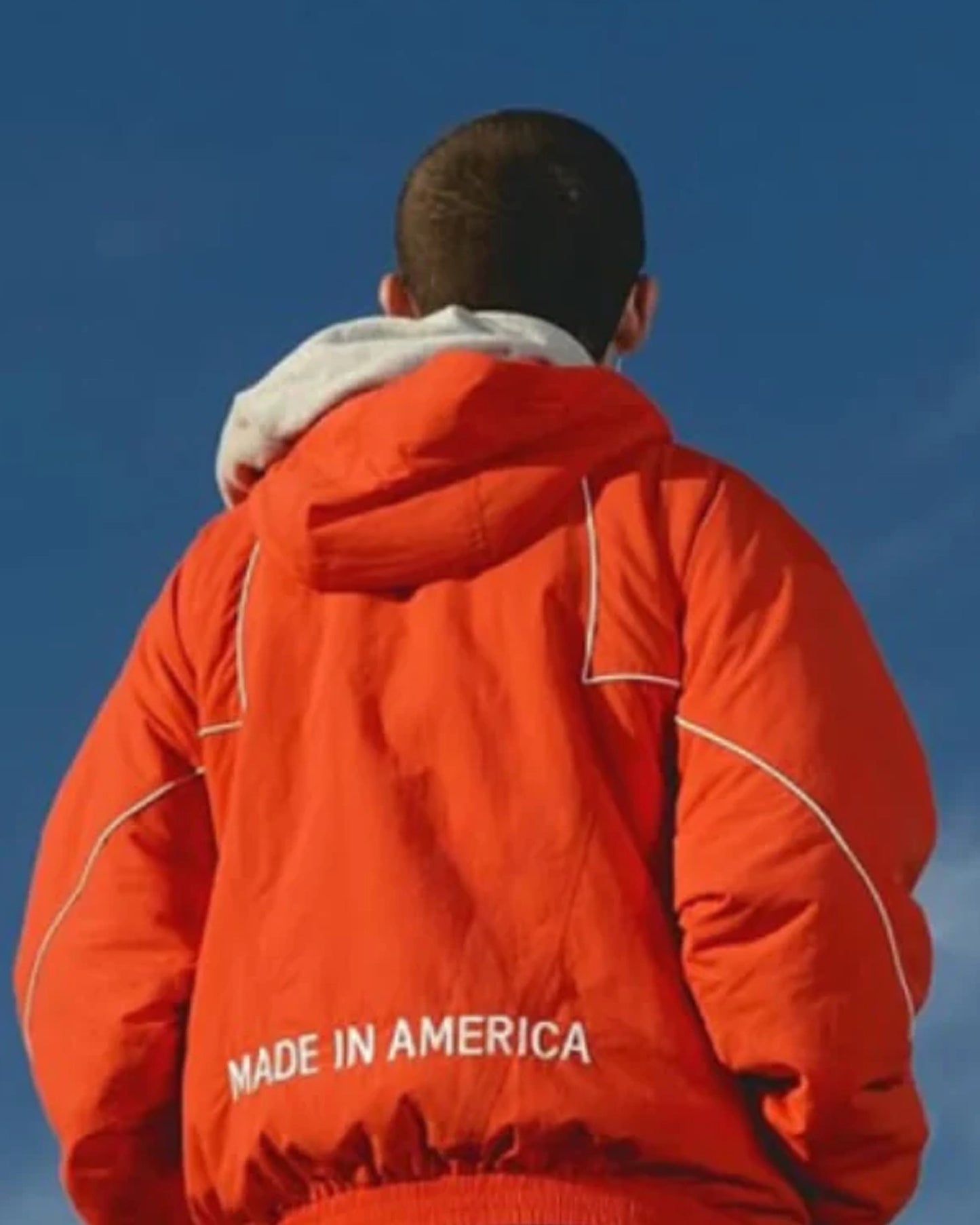 Timothee-Chalamet-Marty-Supreme-Orange-Jacket-Back