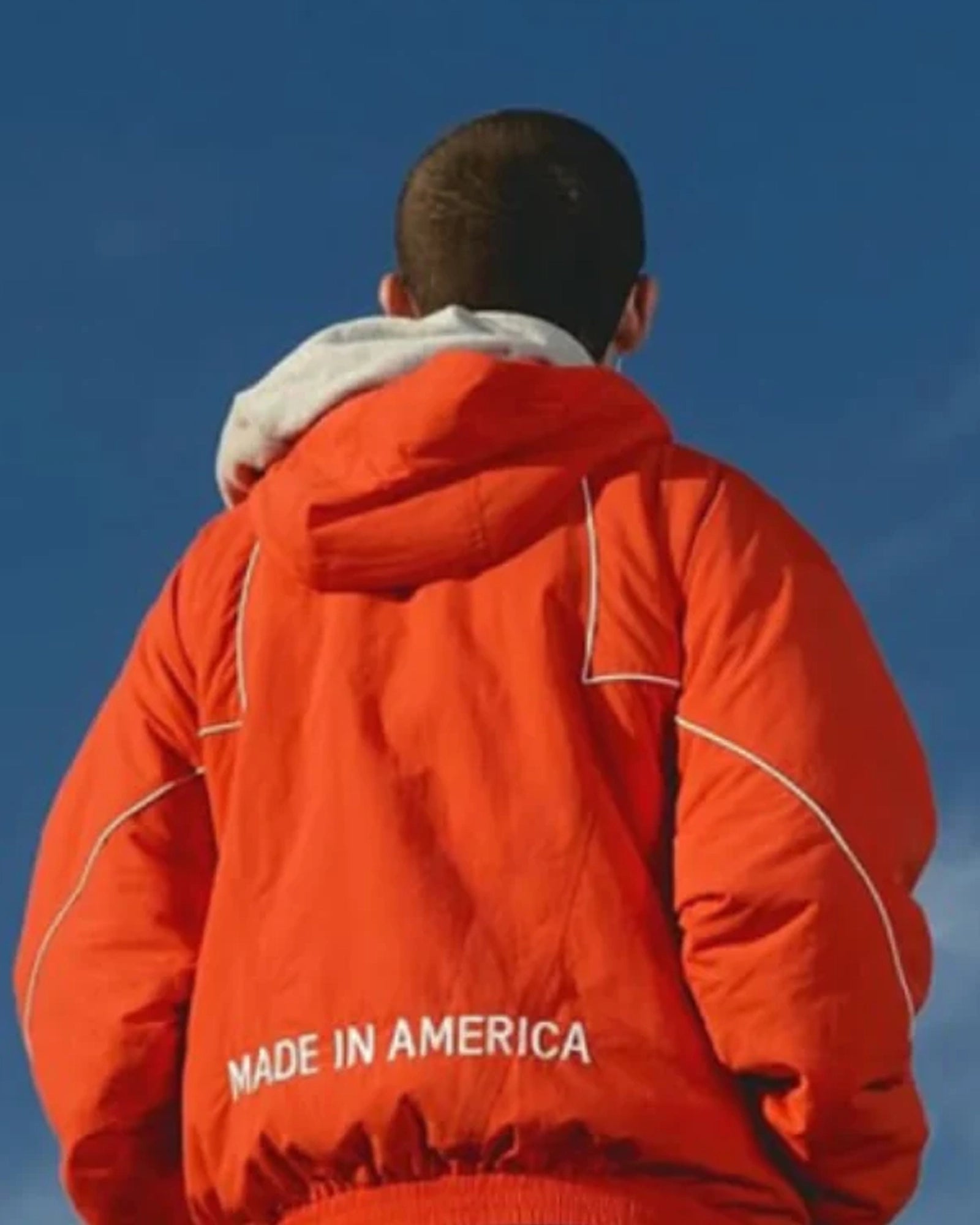 Timothee-Chalamet-Marty-Supreme-Orange-Jacket-Back